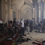 Palestinians clash with Israeli security forces at the Al Aqsa Mosque compound in Jerusalem's Old City Monday, May 10, 2021. Israeli police clashed with Palestinian protesters at a flashpoint Jerusalem holy site on Monday, the latest in a series of confrontations that is pushing the contested city to the brink of eruption. Palestinian medics said at least 180 Palestinians were hurt in the violence at the Al-Aqsa Mosque compound, including 80 who were hospitalized. (AP Photo/Mahmoud Illean)